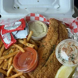 Crispy Lemon Pepper Catfish, extra crispy. Served seasoned with fries.