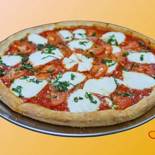 Margherita pizza: Homemade pizza sauce, Fresh mozzarella cheese, Sliced Tomato, Fresh basil, Olive oil.