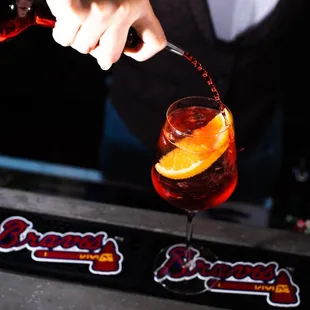 a bartender pouring a drink