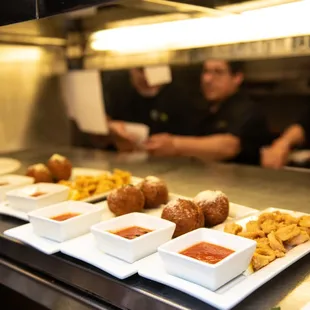 a row of plates of food