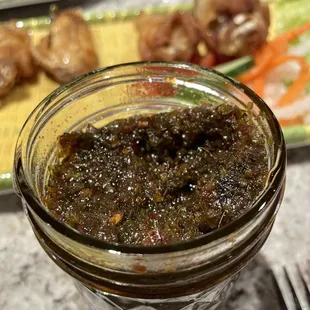 a jar of pickle and a plate of food