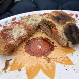 A fig Gorgonzola pizza and an Italian Sub sandwich