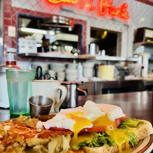 Ordered off the menu avo toast tomato poached eggs potatoes and sausage , try the habanero salsa if you like a kick of heat
