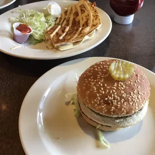 a hamburger and fries on a table