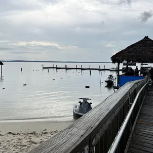 a view of a dock with a thatched hut