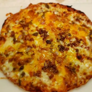 The cooked bacon cheeseburger.