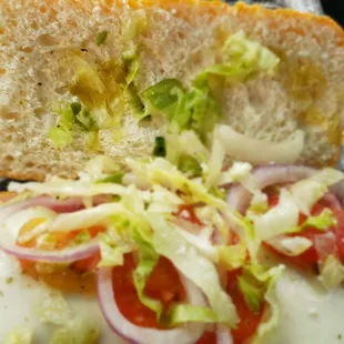 Skimpy toppings compared the the menu picture with no oil. Dry with next to no spices.