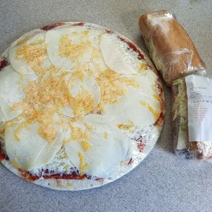 Large cheese lovers pizza and a 12" build your own sub