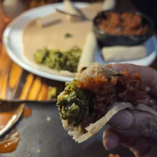 Minced Tuna with greens and injera
