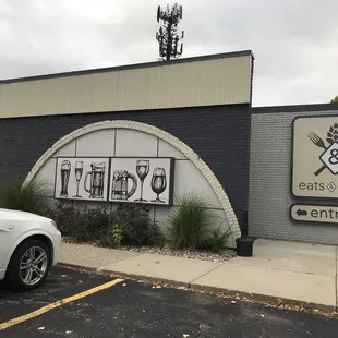 a car parked in front of a restaurant