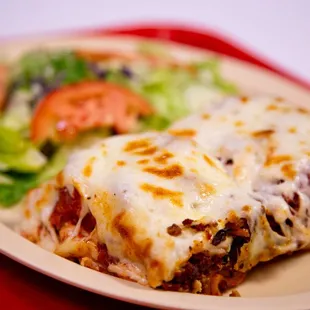 a plate of lasagna and a salad