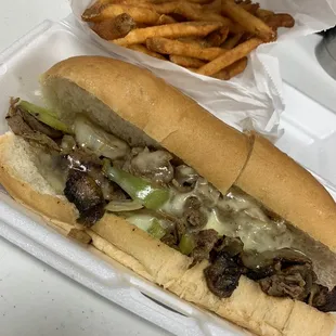 Philly Cheese Steak Hoagie with seasoned fries to go