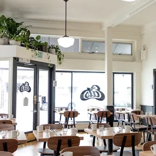 a dining room with tables and chairs