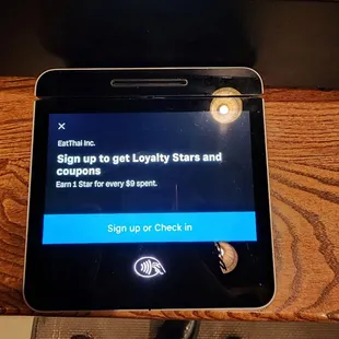 a tablet with a sign up to get loyalty stars and compliment points
