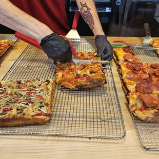 My pizza selection being cut with scissors