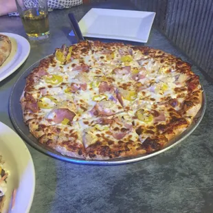 Sauerkraut pizza. Canadian bacon and sausage, sauerkraut and banana peppers.