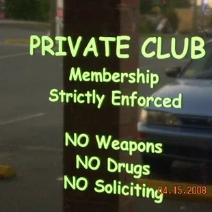 a private club sign on a pole