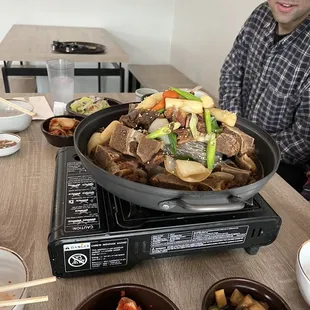 a man sitting at a table with food