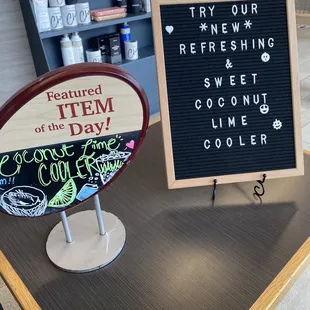 a sign and a sign that says it&apos;s the item of the day