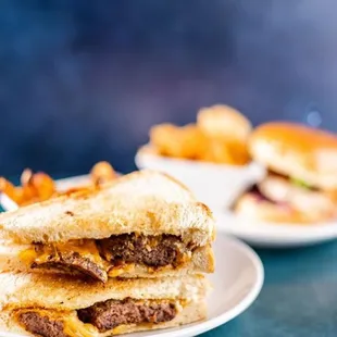 a grilled cheeseburger and fries