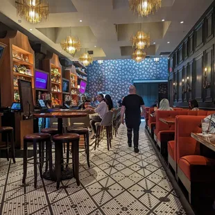 people walking in a restaurant