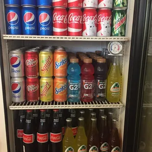 a refrigerator full of sodas