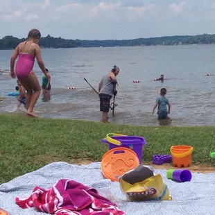 Me. Metal searching for beer caps and broken promises while the kids swim in murky waters of Lake Wylie