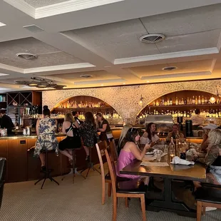 a group of people eating at a restaurant