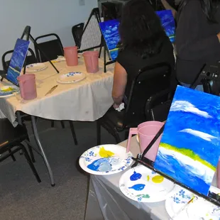  a group of people painting