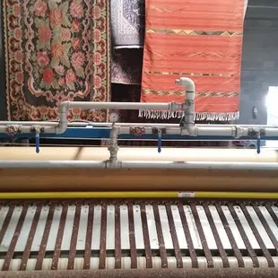 State of the art rug cleaning plant. Full immersion; high pressure squeegee and fan dry from a 40 foot ceiling.