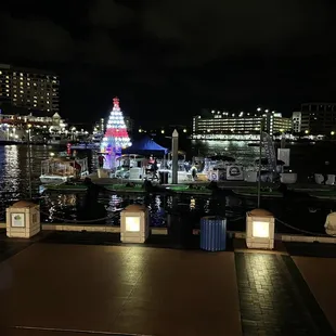 Beautiful night view of the boat dock and the Christmas decoration in the water.