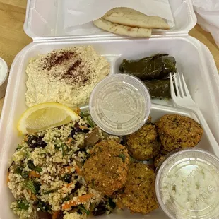 Falafel Plate Specialty - I subbed couscous for the side salad. I added feta, tahini and tzatziki sauce on the side :)