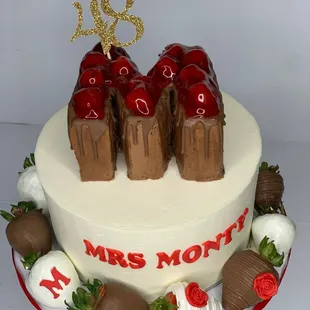 Red velvet cake with chocolate covered strawberries and a chocolate mini cake on top!