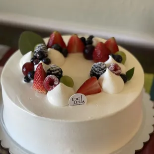 a cake decorated with fresh fruit