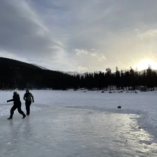 Visitors playing on the frozen lake as the sun sets!