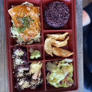 a bento box with a variety of food items