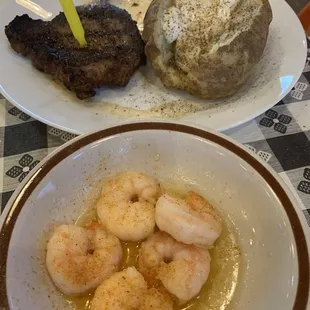 Steak, shrimp and baked potato.