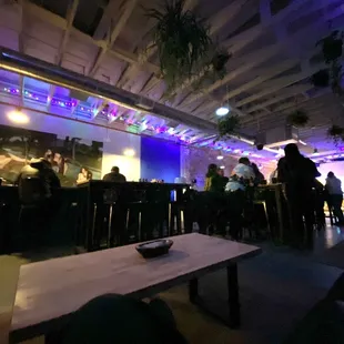 a group of people sitting at a bar