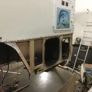 Dry rot repair in process on Cab over camper.