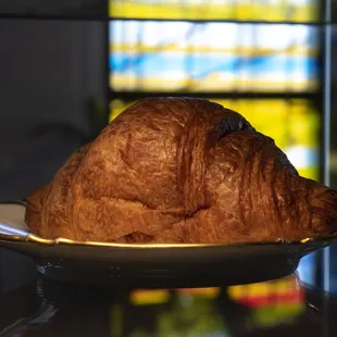 a croissant on a plate