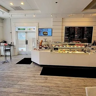 The left side of the store. The menu is on the blackboard.