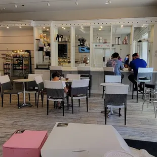 Most of the tables are in that area. There is a refrigerated case with beverages on the left.