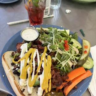 Sonoran dog with salad and prickly pear ice tea
