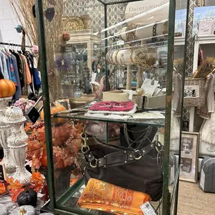 hermés scarf in glass case.