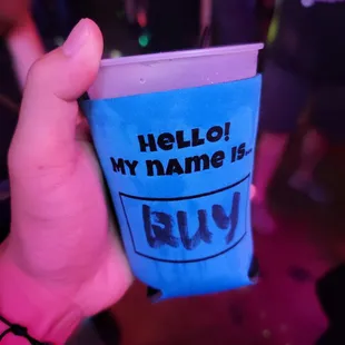 a person holding a blue cup