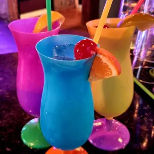 three colorful cocktails