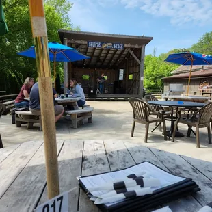 a picnic area with tables and umbrellas