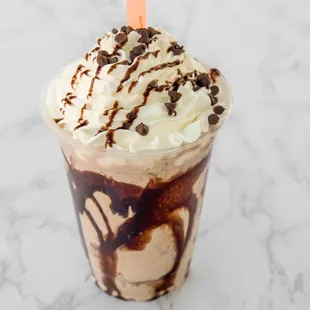 a milkshake with whipped cream and chocolate