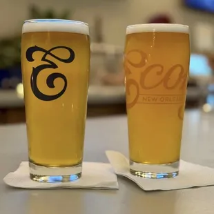 two glasses of beer on a table