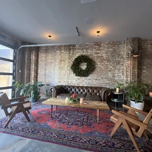 a living room with brick walls